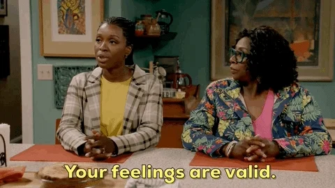 Two women talking to someone. One woman says, 'Your feelings are valid.'
