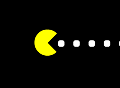 Yellow Pacman eating white dots  entering from the left of the screen