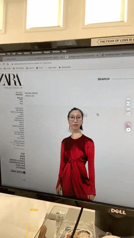 A woman superimposes her head over models' heads on a shopping website.