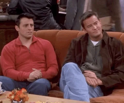 Joey and Chandler from Friends clapping together.