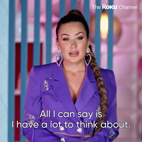 A woman talking, text on screen 