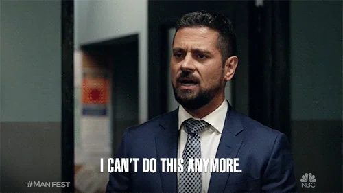 A man shrugging his shoulders saying 