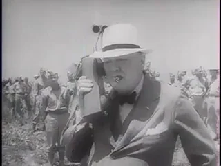 Winston Churchill holds a field radio.