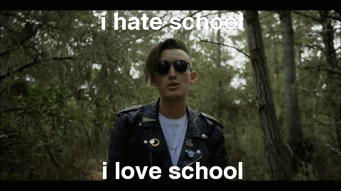 A guy walking in the woods saying 'I hate school, I love school'.