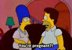 A pregnant Marge Simpson telling Homer about her pregnancy. Homer tears his hair out and runs away.