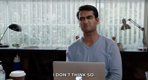 GIF shows a man sitting at his desk in his office with his laptop in front of him saying, 