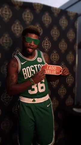 A man wearing a basketball uniform holding a sign that says "I add value."