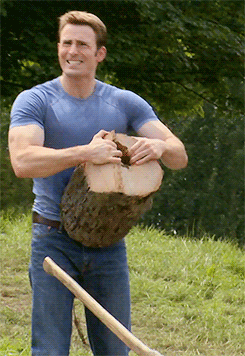 Man ripping log in half