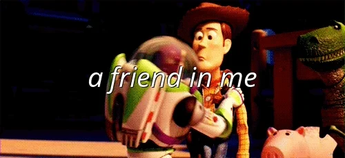 Buzz Lightyear kissing Woody on both cheeks with the words 
