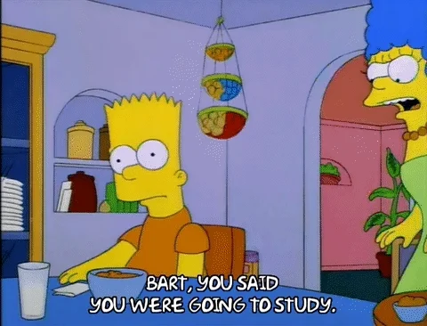 Marge Simpson approaches Bart at the kitchen table. She says, 