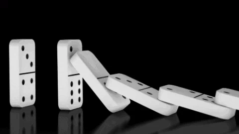 A series of dominos falling.