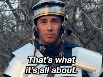 A Roman centurion wearing armor says, 