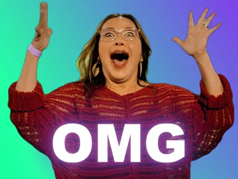 A woman moving side to side with her hands shaking screaming