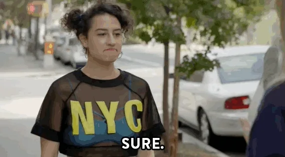 A woman shrugging her shoulders and saying, 