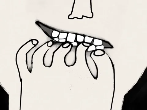 A person bites their fingernails, with only their mouth and hand visible.
