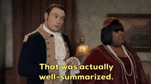 Two people dressed in period piece costumes in a room. One says to the other, 