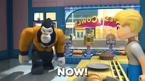 A cartoon gorilla at a cafe slams his firsts on the counter and says, 'Now!'