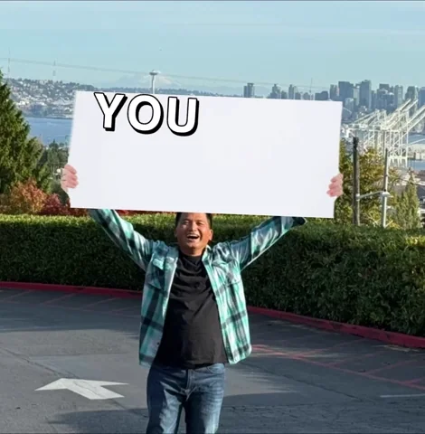 A man holding up a sign flashing the words: 
