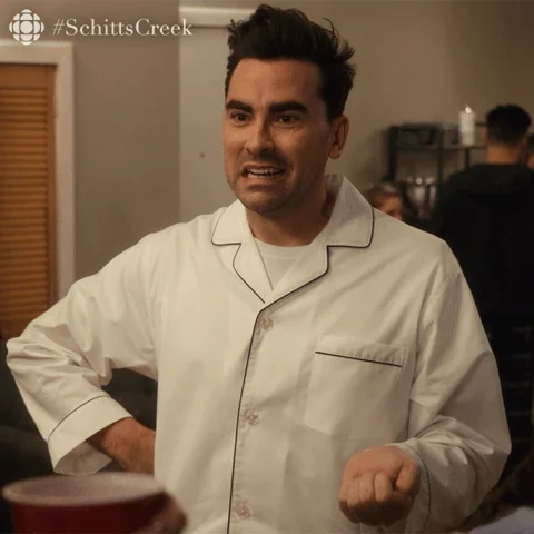 David Rose from Schitt's Creek, waving his hand and asking,
