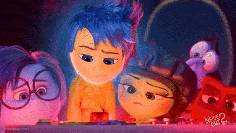 A scene from Disney's Inside Out. Joy, Sadness, Anger, and Envy are panicking. 