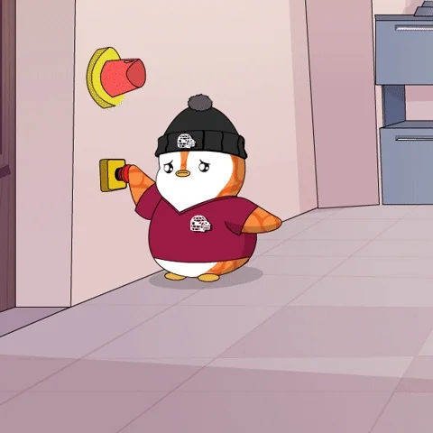 A penguin rushing around in panic trying to press a red emergency button.