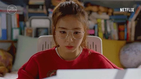 A young woman at her desk. She says, 'I've always been great, but this time, I really want to be outstanding. Let's do this!'