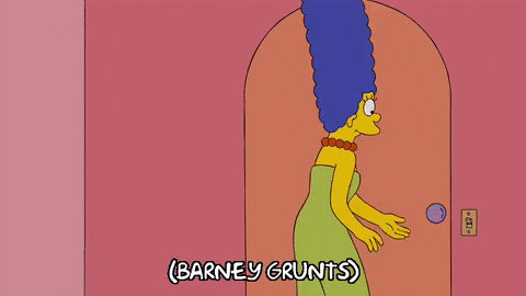Marge Simpson opens the door to see Barney standing  there with the words 'Turn on the radio' written on his chest