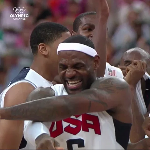Lebron James jumping up and down with his teammates.
