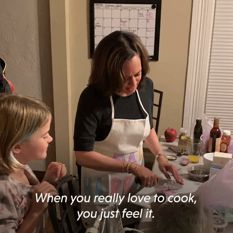 Kamala Harris is chopping onions. She says to the little girl next to her 