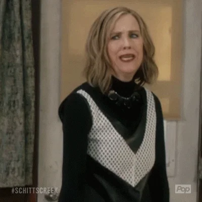 Moira Rose from Schitt's Creek raises her fist and says, 
