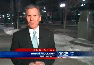 A humorous news broadcast where a civilian attempts to kiss reporter Brian Mullahy. The lower third graphics set the scene.