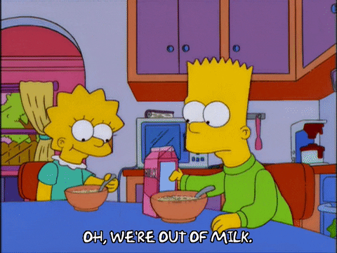 Bart Simpson trying to pour milk onto his cereal, but it is all gone.
