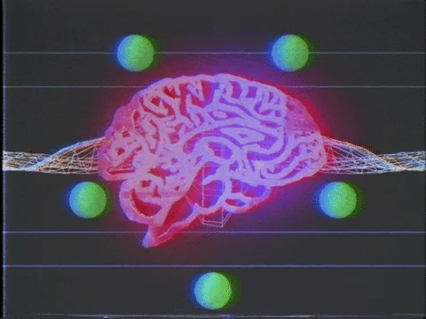 An animation depicting a mind with green orbs circling it and waves emanating from it.