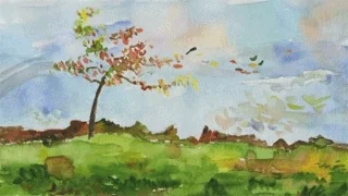 Wind blows leaves off a tree, leaving the tree bare.
