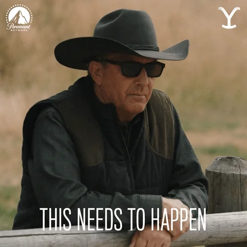 A man in a black outfit and cowboy hat saying, 'This needs to happen.'