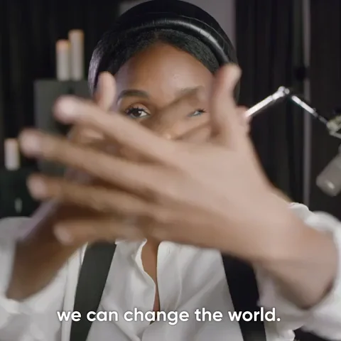 A young black woman saying, 'We can change the world.'