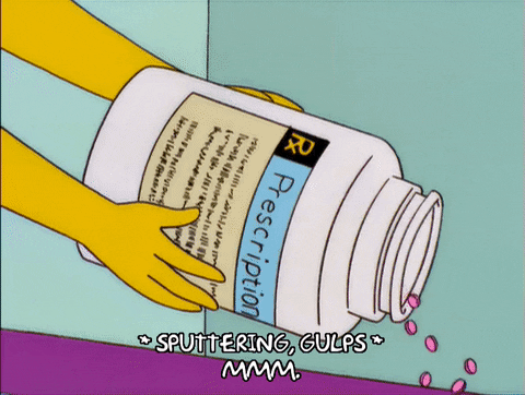 Homer with bandages being fed meds.