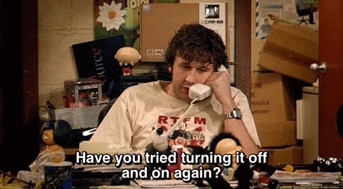 Roy from the IT Crowd speaking into a phone. He says, 