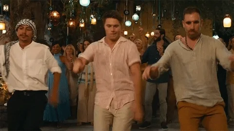 Greeks dancing a traditional dance.