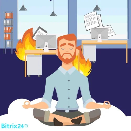 A person meditating in their office while a fire breaks out at their desk.