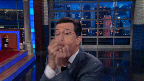 Stephen Colbert blowing a kiss and saying, 