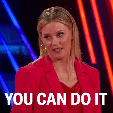 A woman saying "you can do it" with determination.