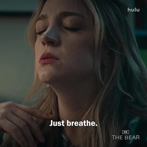Natalie from The Bear closes her eyes and says, "Just breathe."