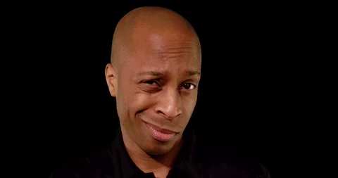 Man tapping his head with two fingers