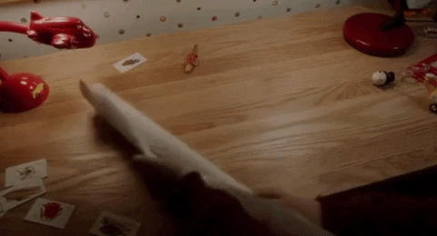 GIF of kid unrolling a 'battle plan' from the movie Home Alone