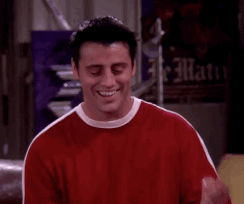 Joey from Friends pointing to his head saying 
