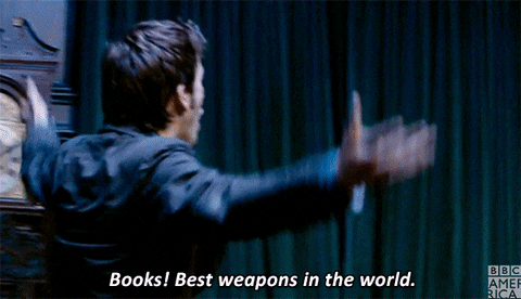 Dr. Who confidently walks up to a bookshelf and says, "Books! Best weapons in the world" then turns and wears his glasses.