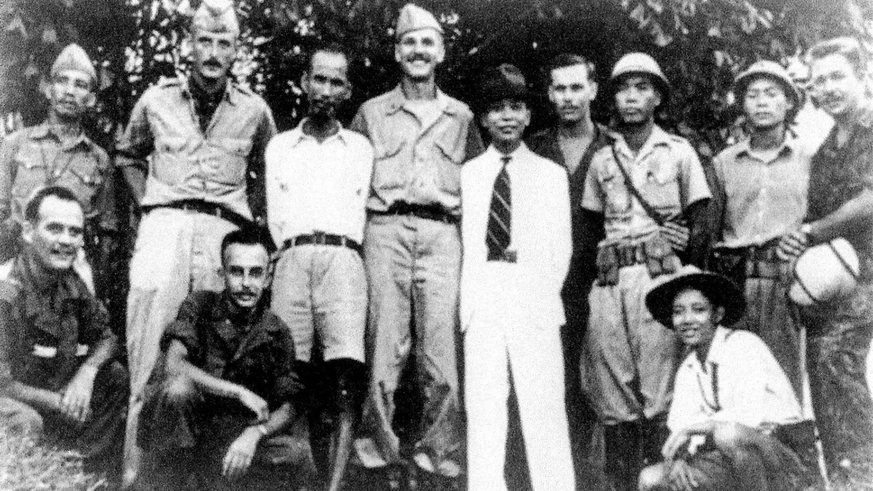 American OSS officers stand side-by-side with Ho Chi Minh and Viet Minh resistance forces.