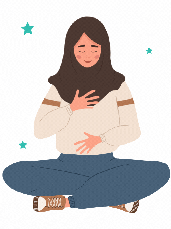 A woman practices pranayama exercises. She has one hand placed on her belly and one on her heart. 