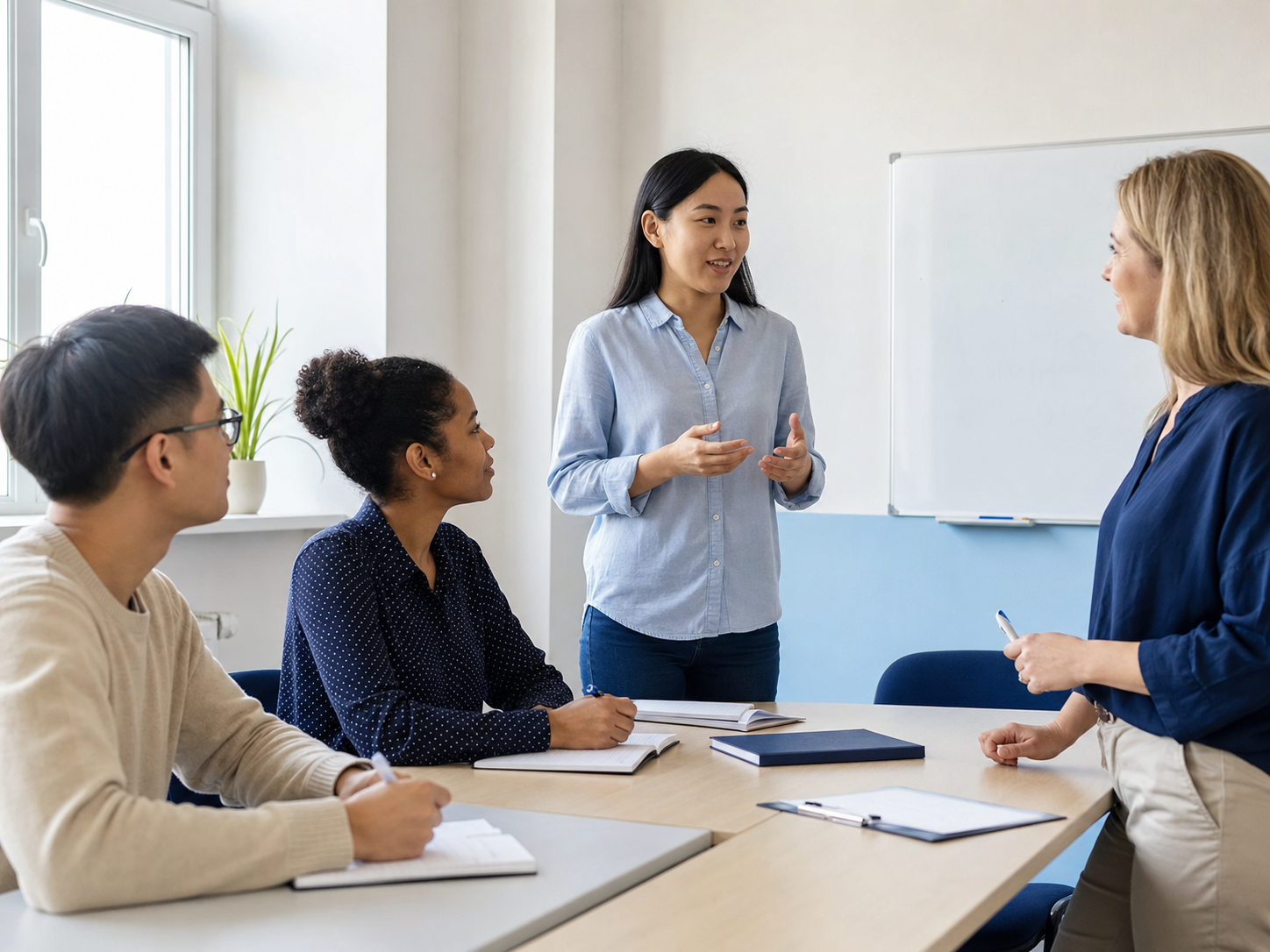A certified trainer coaching a learner during a speaking session